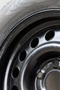 Used winter studded tire for car.Studded wheel for car close-up Royalty Free Stock Photo