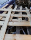 used wooden pallets inside the recycling container of used mater