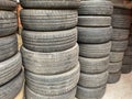 Used worn out tyres stacked together