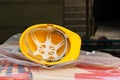 Used yellow protective helmet on the construction site Royalty Free Stock Photo