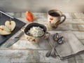 Useful breakfast of cottage cheese, pear, tableware, tea in a rustic mug Royalty Free Stock Photo