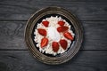 Cereal curd with strawberries and sour cream on a wooden table Royalty Free Stock Photo