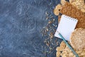 Useful dietary, crispbread, flakes, buckwheat, cookies with sunflower and pad, pencilon on a textured background Royalty Free Stock Photo