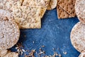 Useful dietary, crispbread, flakes, buckwheat, cookies with sunflower on a textured background Royalty Free Stock Photo