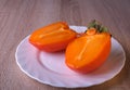 Persimmon fruit, close ripe fruits on a plate