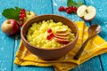 Useful millet porridge with apple and red currant Royalty Free Stock Photo
