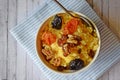 Useful porridge of corn grits and dried fruits.