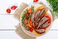 Useful sandwiches: goose breast on pumpkin bread, salad from tomatoes, arugula, red onions Royalty Free Stock Photo