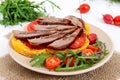 Useful sandwiches: goose breast on pumpkin bread, salad from tomatoes Royalty Free Stock Photo