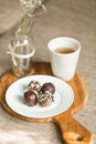 Useful sweets with coconut in chocolate and tea