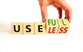 Useful or useless symbol. Concept words Useful or Useless on wooden cubes. Businessman hand. Beautiful white table white Royalty Free Stock Photo