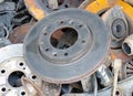 Useless  worn out old rusty brake discs and other spare parts Royalty Free Stock Photo