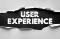 USER EXPERIENCE concept torn paper design with bold distressed typography on textured background, modern creative message Royalty Free Stock Photo