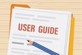 User guide with pencil. Paper sheets and folder on table. User manual top view. FAQ, guidance. Reading and studying instructions Royalty Free Stock Photo