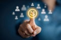 Person selecting a bright glowing smiley face icon among blurred user symbols symbolizing positive customer feedback and user Royalty Free Stock Photo