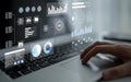 User interacts with laptop displaying data analytics, graphs, charts, artificial intelligence insights on transparent Royalty Free Stock Photo