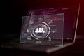 User interface icon with team management and data analytics symbol overlay on laptop screen showing source code, representing Royalty Free Stock Photo