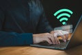 User logs into a laptop computer using a Wi-Fi connection, entering a username and password. Royalty Free Stock Photo