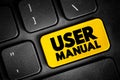 User Manual - intended to assist users in using a particular product, service or application, text concept button on keyboard Royalty Free Stock Photo