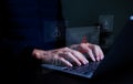 User or it staffs, programmer, developer using computer laptop with triangle caution warning sign for notification error and Royalty Free Stock Photo