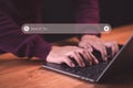 User use a computer laptop for internet search bar. SEO technology networking engine optimization internet with search bar. Royalty Free Stock Photo