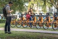 users access the APP for Urban bikes for hire in Tembici Station of Bike in Faria Lima Avenue Royalty Free Stock Photo