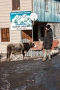 Ushguli guest house Boria. A happy woman and a cow on the village streets
