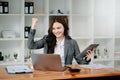 usiness woman are delighted and happy with the work they do on their tablet, laptop and taking notes at the modern office