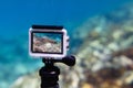Using action-camera in waterproof box to make photos and video underwater