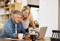 Using any popular search engine you can find anything. a mature couple using a laptop together. Royalty Free Stock Photo