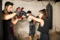 Using boxing mitts during boxing class