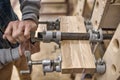 Using clamps and glue to connect wooden timbers for furniture detail Royalty Free Stock Photo