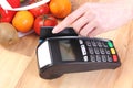 Payment terminal with credit card, fruits and vegetables, cashless paying for shopping Royalty Free Stock Photo