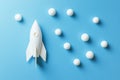 Using 3D rendering, an image of a white rocket launching with clouds on a blue background can be seen to the right Royalty Free Stock Photo