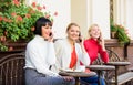 Using digital devices. Group women cafe terrace. Mobile addicted. Mobile conversation. Girls with mobile phones. Friends Royalty Free Stock Photo