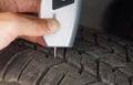 Using a digital tire tread depth measuring tool with old tire