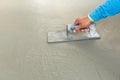 Using float to level surface of concrete