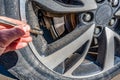 Using a hand guage to check tire pressure Royalty Free Stock Photo