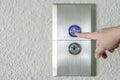 Using hands, press the elevator up and keypad elevator Royalty Free Stock Photo