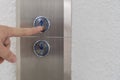 Using hands, press the elevator up and keypad elevator Royalty Free Stock Photo