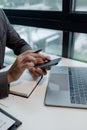 he is using his phone to find information to use in presenting information, Entrepreneurs use smartphones to keep in touch with