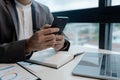 he is using his phone to find information to use in presenting information, Entrepreneurs use smartphones to keep in touch with