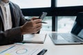 he is using his phone to find information to use in presenting information, Entrepreneurs use smartphones to keep in touch with