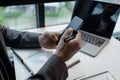 he is using his phone to find information to use in presenting information, Entrepreneurs use smartphones to keep in touch with