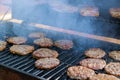 Using a hot grill, the American beef burger is grilled to perfection Royalty Free Stock Photo