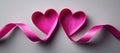 Using image technology, pink ribbon tape forms a heart shape Royalty Free Stock Photo