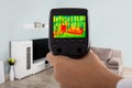 Using Infrared Thermal Camera In Living Room Royalty Free Stock Photo