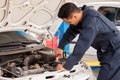 Using jumper cables to start a car Royalty Free Stock Photo