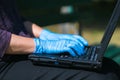 using laptop keyboard with gloves on Royalty Free Stock Photo