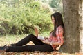 Using laptop-student learns outdoors Royalty Free Stock Photo